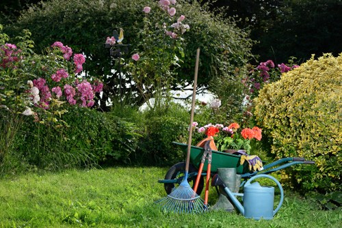 Professional North End landscaping with patio, retaining wall, and seasonal plants