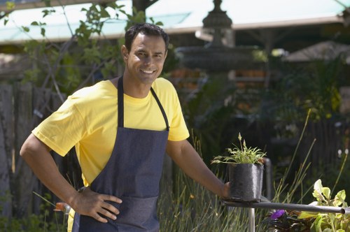 Professional gardener in North End wearing PPE while working outdoors
